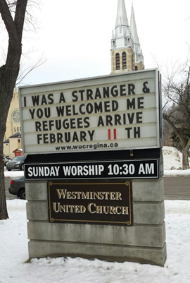 Westminster United Church Street Sign: I was a stranger & You welcomed me refugees arrive Feb 11th