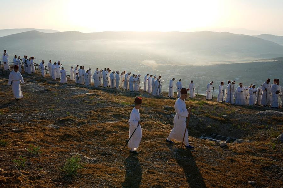 Members of the ancient Samaritan community pray during the holiday of Shavuot on Mount Gerizim.