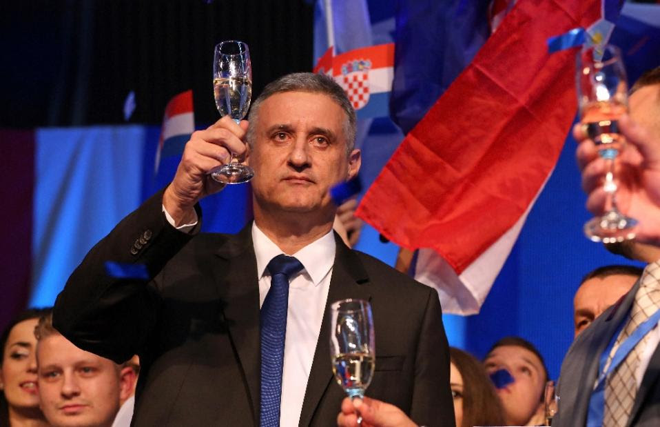 Leader of Croatian Democratic Union/HDZ Tomislav Karamarko raises a glass to relative victory at 2015 general elections in Croatia Victory not enough to form government Photo: AFP
