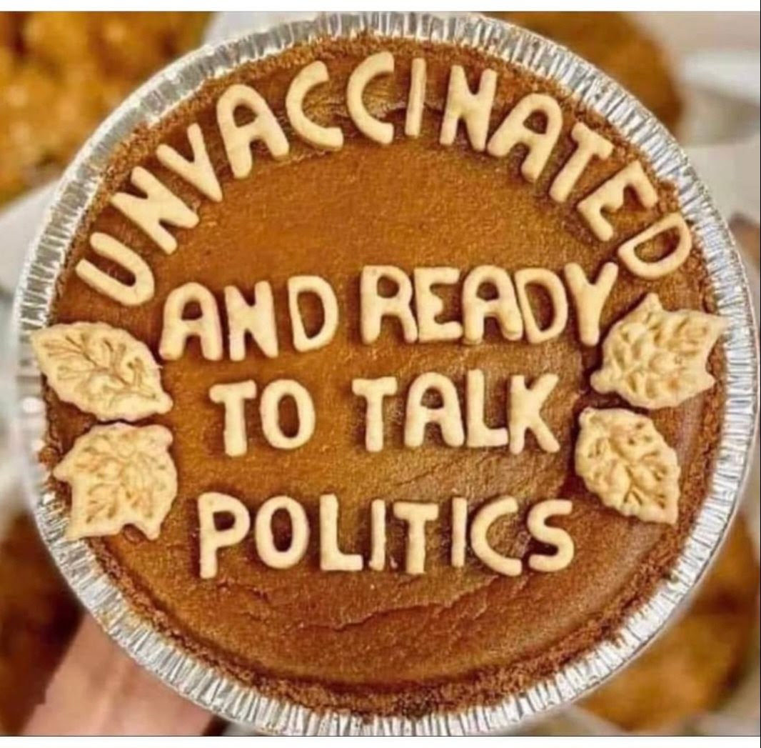 Pumpkin pie with funny crust saying I am unvaxxed and want to talk politics.