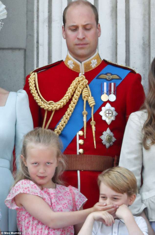 Unamused: The Duke of Cambridge gives Savannah and Prince George a disapproving look