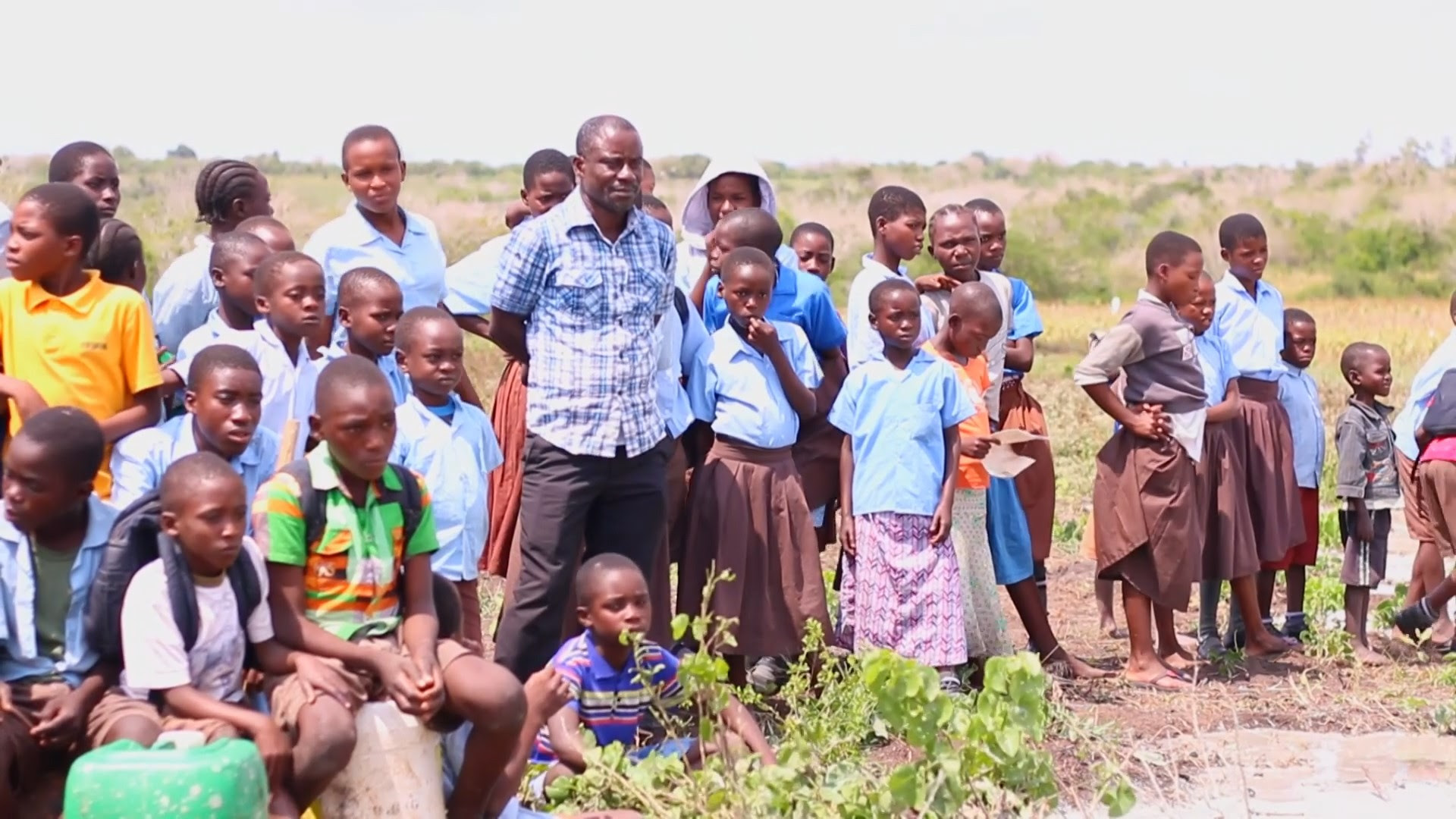 Photo of Emmanuel Baya teaching organic farming techniques to children in his care.