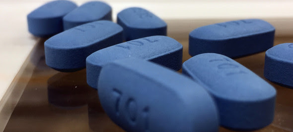 Blue pills on a flat surface