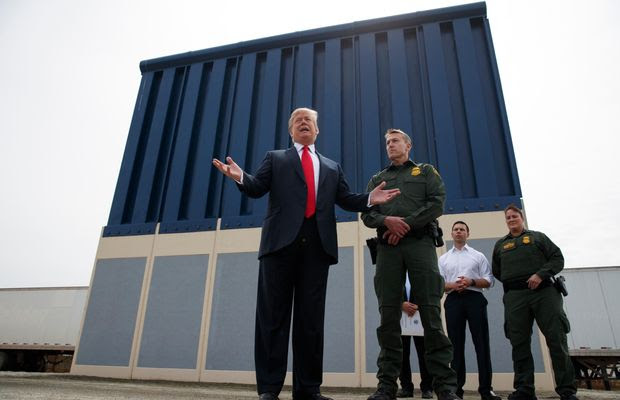 In this March 13, 2018, file photo, President Donald Trump talks with reporters as he reviews border wall prototypes in San Diego. (AP Photo/Evan Vucci, file)