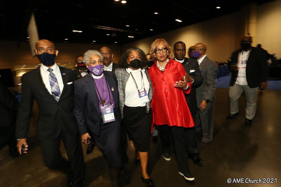 The Rev. Francine A. Brookins, center, walks with Bishop Anne Byfield, center left, and Bishop Vashti McKenzie, center right, to the stage after Brookins was elected during the African Methodist Episcopal Church conference in Orlando, Florida, in July 2021. Photo courtesy of the AME Church