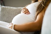 Pregnant woman on couch