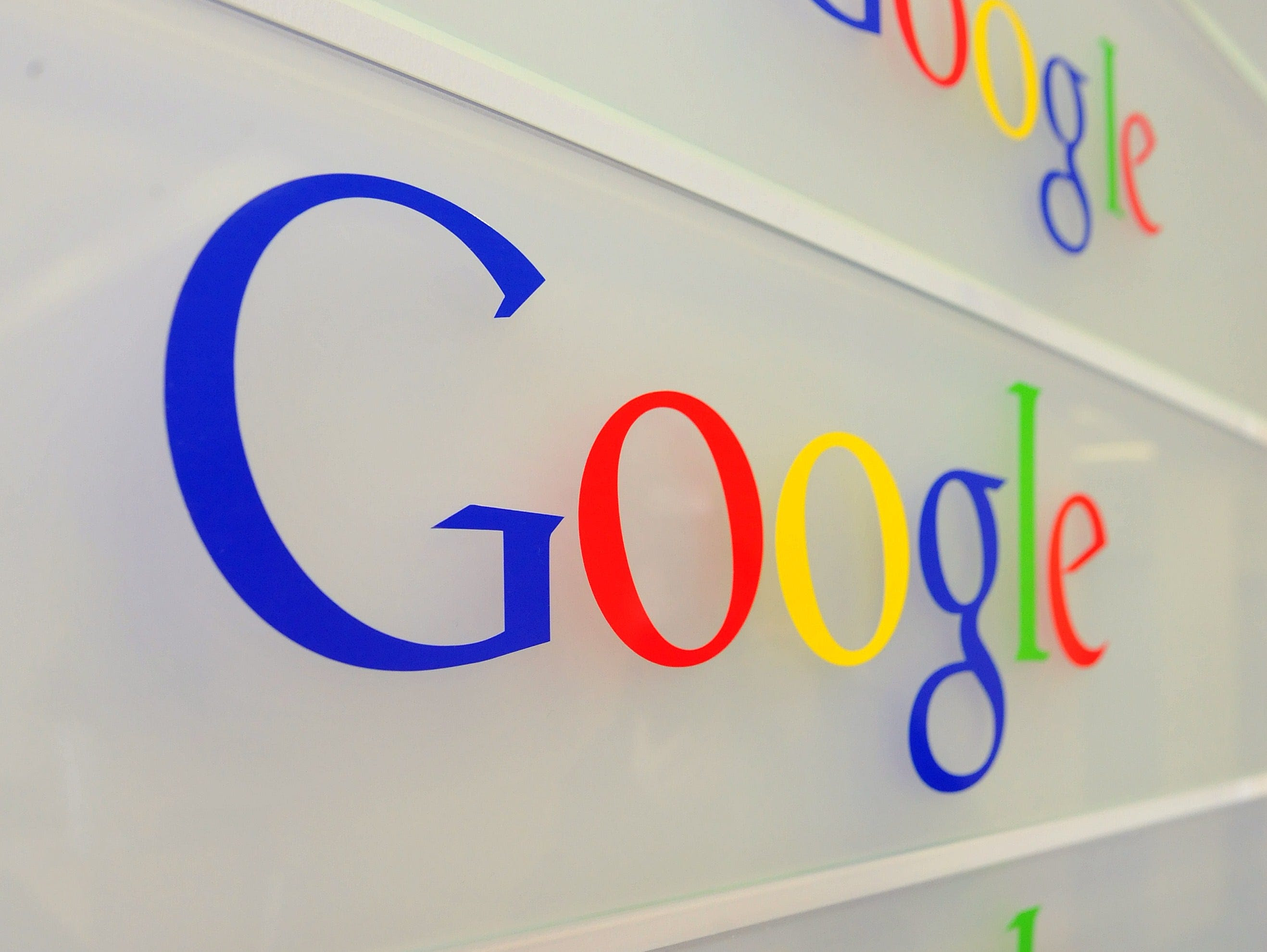 Google logo is seen on a wall at the entrance of the Google offices in Brussels on February 5, 2014.