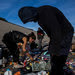 Separating trash for recycling in El Bordo, a catch basin for the addicted and the deported in Tijuana.