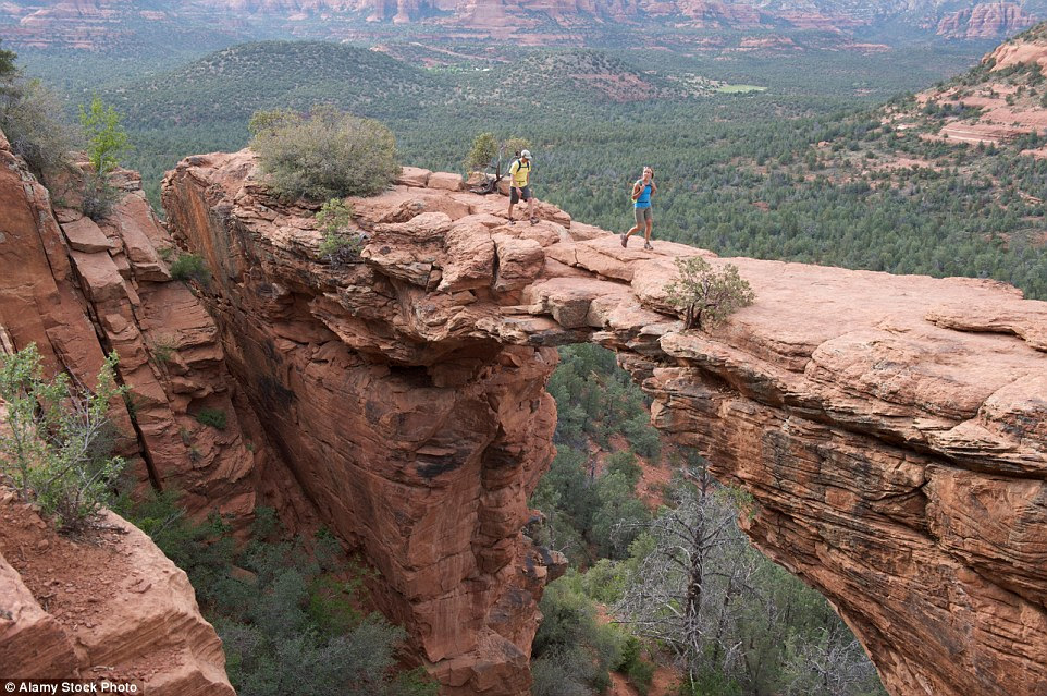 You won't want to stumble while walking across the Devil's Bridge in Red Rock-Secret Mountain Wilderness Area outside Sedona, Arizona, which has sheer drops either side of its arched structure