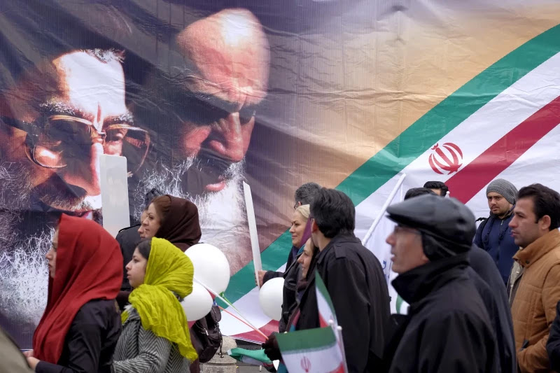 Marching in front of portraits of Khomeini and Khamenei, Tehran, February 2016. Raheb Homavandi / Reuters