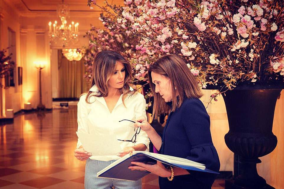 Earlier in the day, the first lady tweeted pictures of herself huddling with her social secretaryÂ Rickie Niceta (right) as the two women went over last minute details for Tuesday's state dinner with France