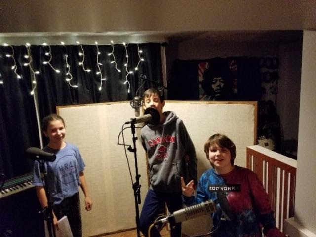 Paige (voice of Chloe), Isaac (voice of Mitchell), and Jakob (voice of Jasper) recording Scribblers.