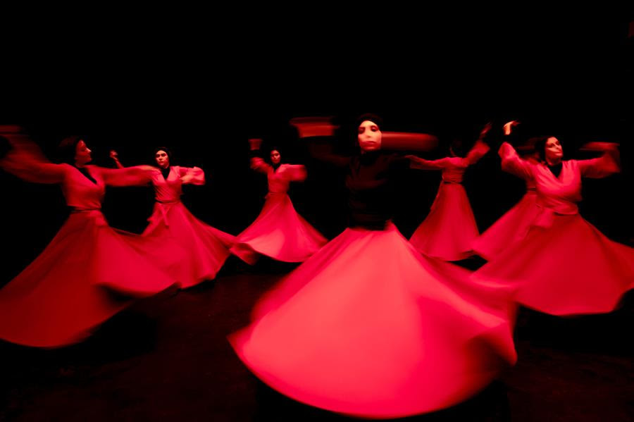 Khishtan art group perform the Sama dance, or a Sufi dance, at a theater hall in downtown Tehran, Iran, Friday, Oct. 15, 2021. Sama is a popular form of worship in Sufism. (AP Photo/Ebrahim Noroozi)