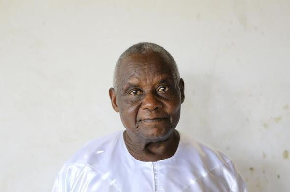 Omukama Ruhanga Owobusobozi Bisaka, an 83-year-old self-professed god and founder of the Ugandan cult group Faith of Unity, is photographed in his house at the cult's headquarters in Kapyemi village in Muhoro town council, 251 km (156 miles) west of the Uganda capital, October 12, 2013. REUTERS-James Akena