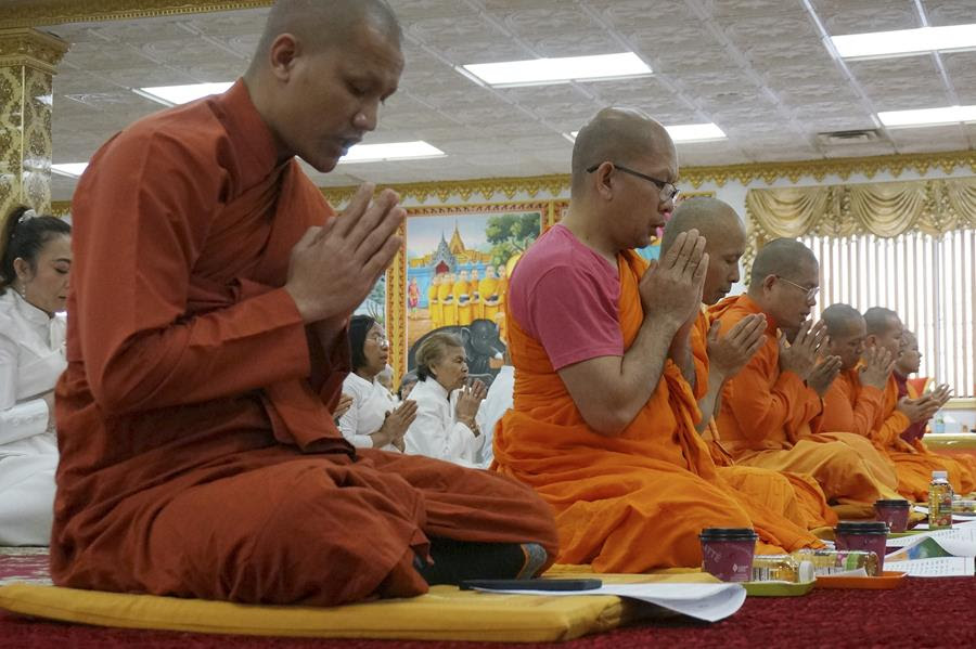 People pray in a Buddhist temple in Minnesota.