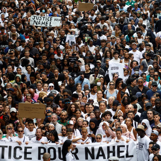 People attend a march in tribute to Nahel, a 17-year-old teenager killed by a French police officer during a traffic stop, in Nanterre, Paris suburb, France, June 29, 2023. The slogan reads "Justice for Nahel". REUTERS/Sarah Meyssonnier