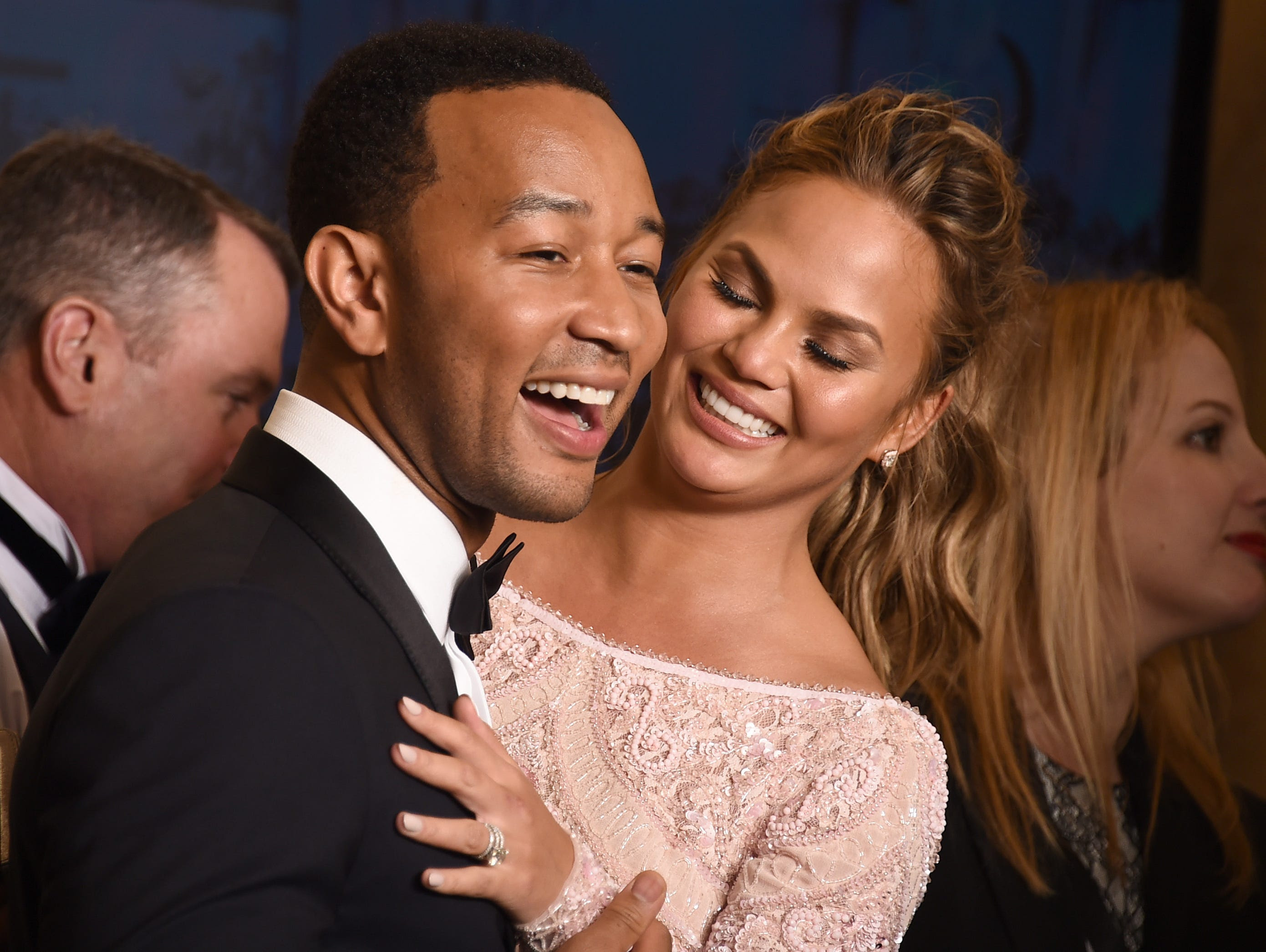 John Legend, winner of the award for best original song ìGloryî in a film for ìSelmaî, poses with Chrissy Teigen, right, in the press room at the 72nd annual Golden Globe Awards at the Beverly Hilton Hotel on Sunday, Jan. 11, 2015, in Beverly Hills, 