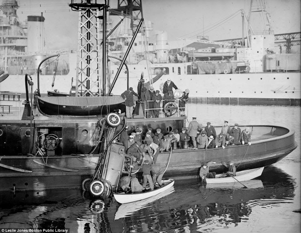 A fireboat struggles to haul a car out of the Fore River in Quincy, Massachusetts in 1933. They succeeded, but couldn't save the three passengers, who drowned