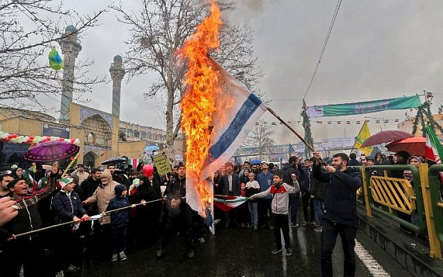 Iranians burn Israeli flags during commemorations in the capital Tehran of the 40th anniversary of the Islamic on February 11, 2019. (Atta Kenare/AFP)