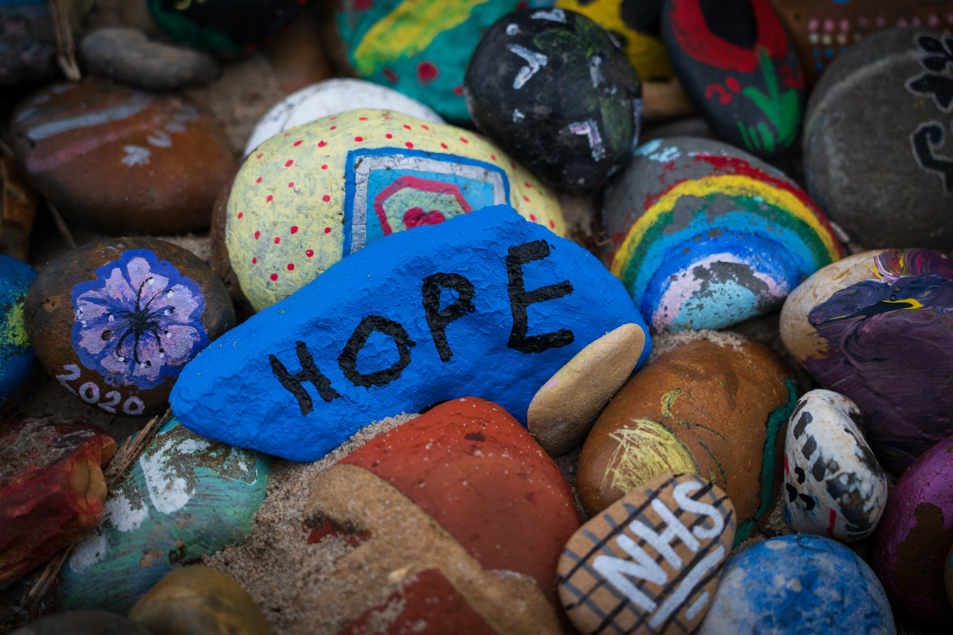 Image of painted rocks with the words hope