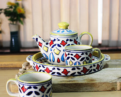 Ceramic tea cups with hand-painted designs tea set