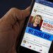 A cellphone displays a Hillary Clinton campaign post on Facebook promoting her bid for the presidency in the 2016 election.