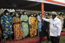 Ivory Coast President Alassane Ouattara waves to local leaders as he arrives to a rally in Anyama, in the outskirts of Abidjan, Ivory Coast, Wednesday, Oct. 28, 2020. Ouattara, who first came to power after the 2010 disputed election whose aftermath left more than 3,000 people dead, is now seeking a third term in office. The candidate maintains that he can serve a third term because of changes to the country's constitution, though his opponents consider his candidacy illegal. (AP Photo/Leo Correa)