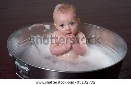 Other baby baths may use a kind of sling or hammock that holds the baby over the tub while you bathe them. 6 Month Old Boy Bathing In A Galvanized Tub Infant Child Bubble Bath Stock Images Page Everypixel
