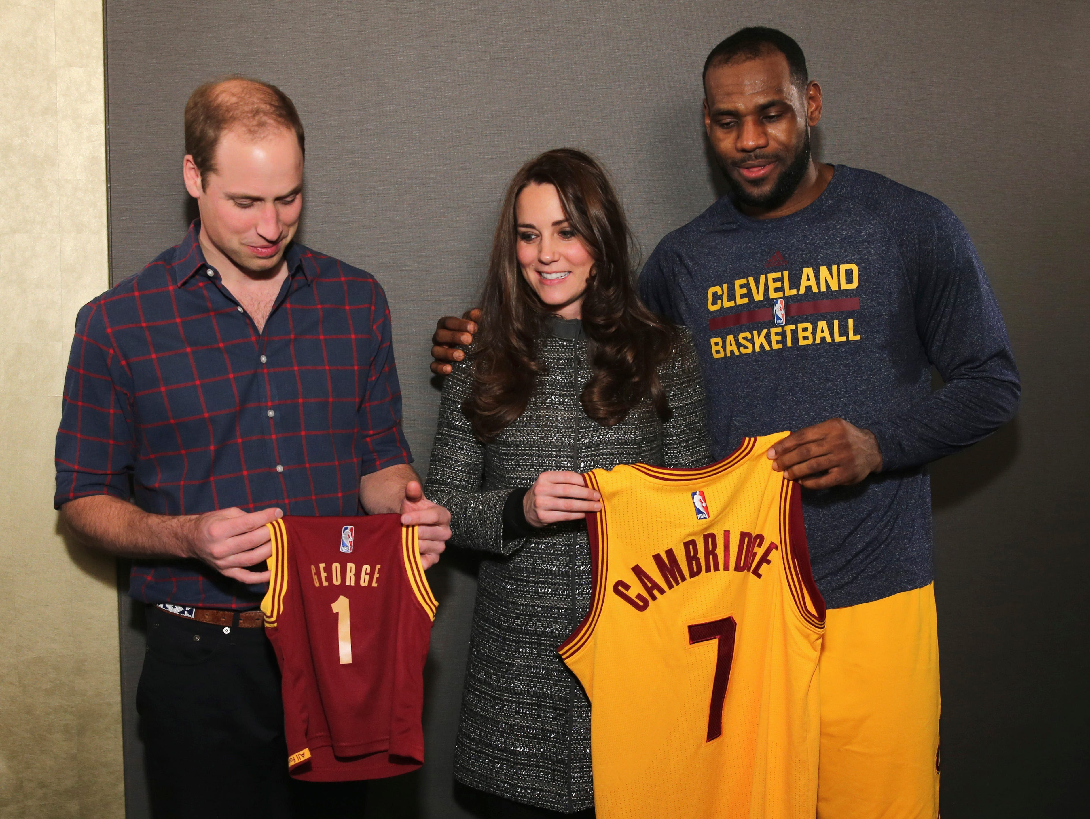 Prince William, Duchess Kate and LeBron James pose after a basketball game between the Cavaliers and the Brooklyn Nets on Dec. 8 in New York.
