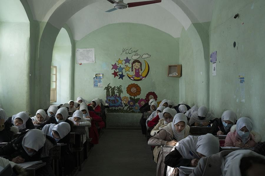 Afghan girls participate a lesson inside a classroom at Tajrobawai Girls High School, in Herat, Afghanistan, Nov. 25, 2021.