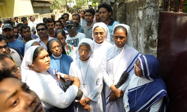  Nuns and other locals in front of a convent school at Ranaghat, 79km north of Kolkata, where robbers raped an elderly nun. Photograph: STR/EPA