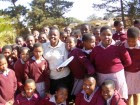 Nomcebo-Mkhalipho-posig-with-girls-from-Kwaluseni-Infantry-Primary-School--140x105.jpg