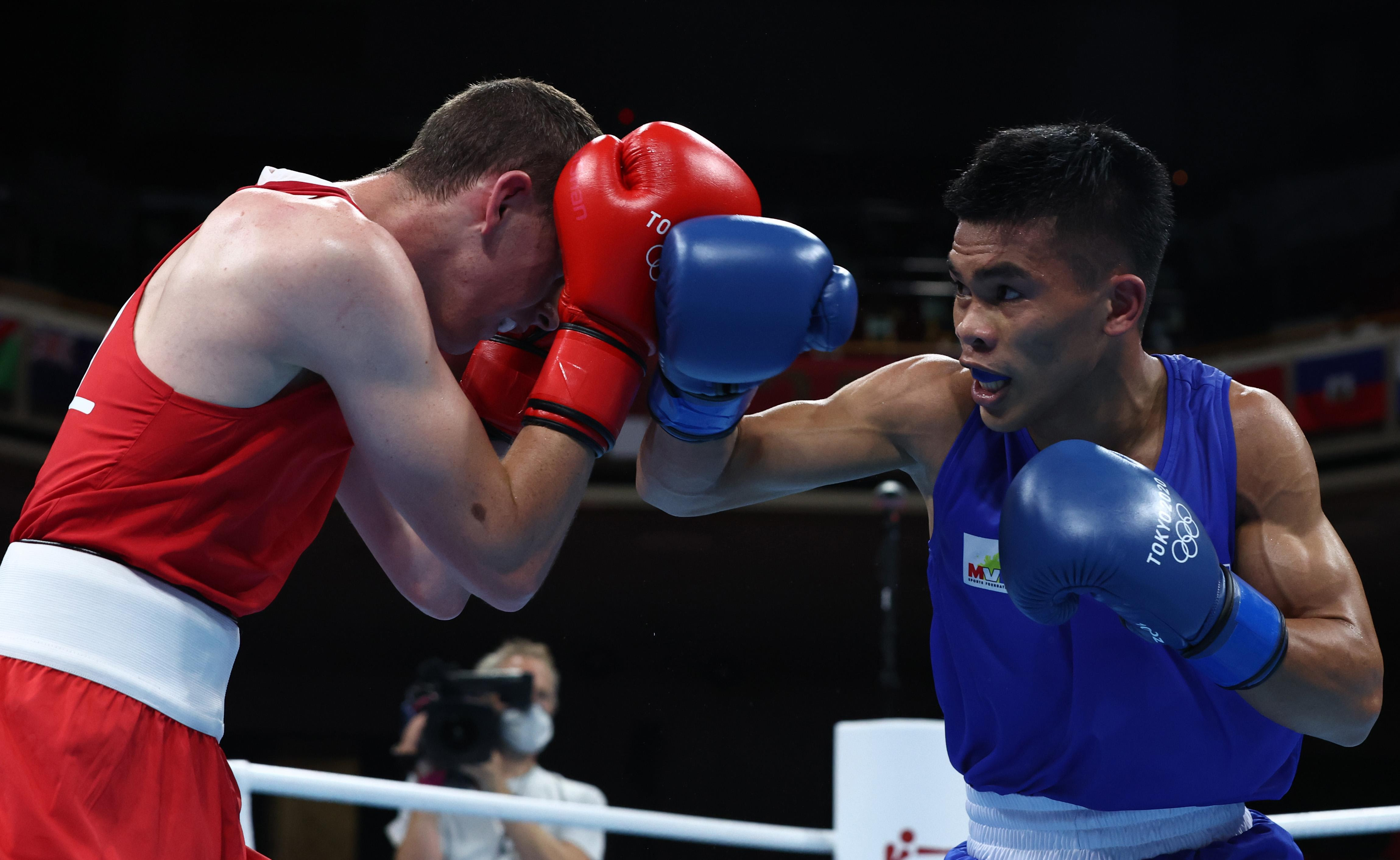 Carlo paalam knocks off olympic champion shakhobidin zoirov. Carlo Paalam Continues Ph Olympic Boxing Streak After Round Of 32 Win Gma News Online