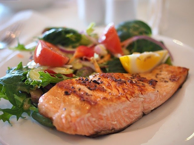 Photo of a plate of seared salmon and salad.