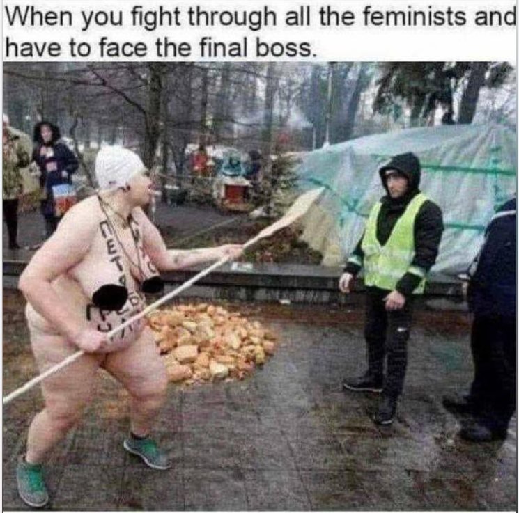 Photo of a huge fat naked feminist holding a spear.