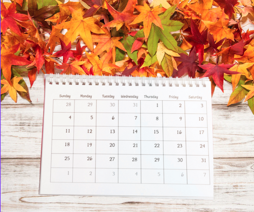 Calendar with fall leaves surrounding it