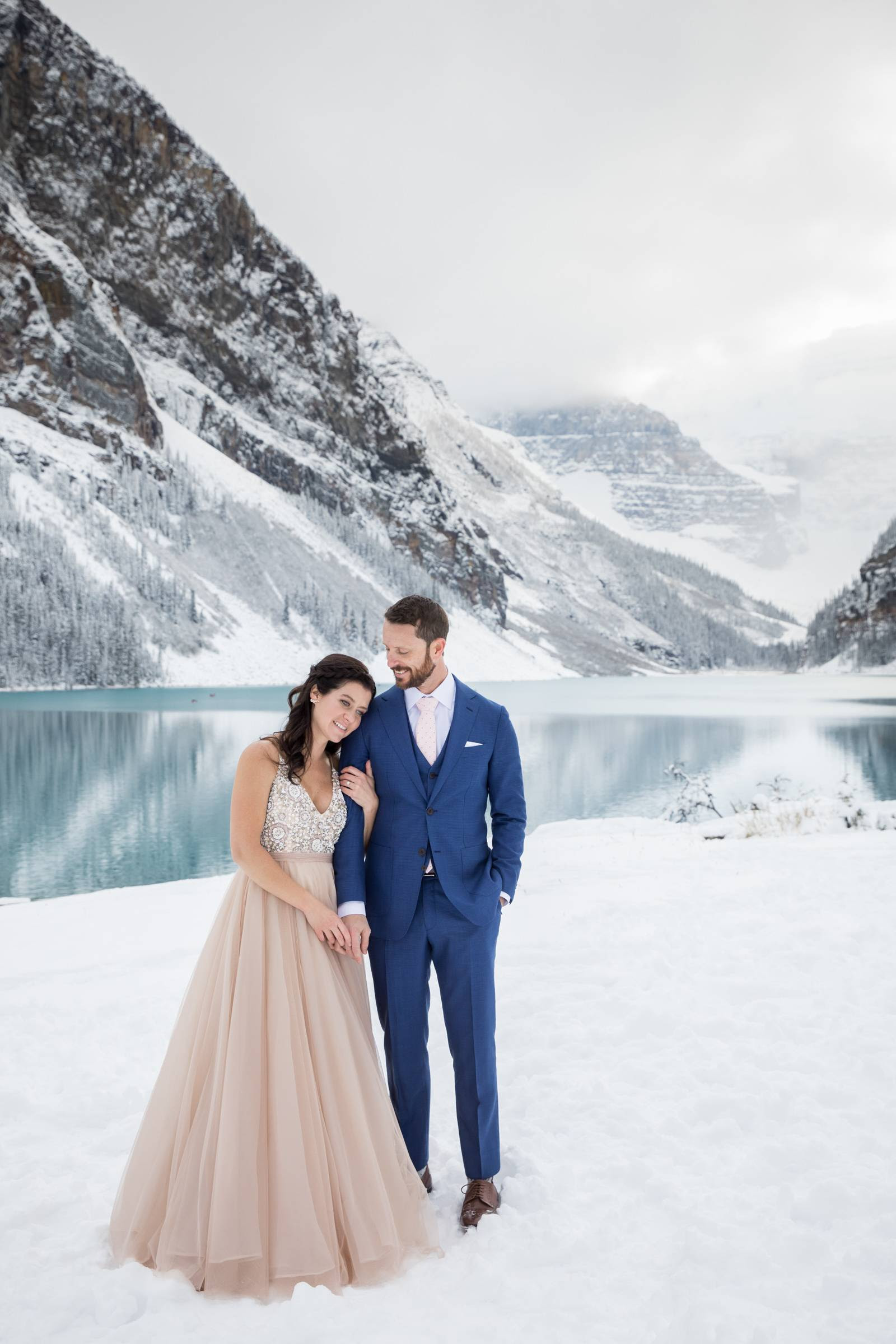A bold, beautiful color palette of pink and purple, details inspired by the literary classic, and chic, elegant style combine to create a wedding look that would be perfect for a springtime wedding… Lake Louise Winter Wonderland Wedding Lake Louise Wedding Photographer Lake Louise Item 30