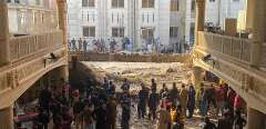 Security officials inspect the site of a mosque blast inside the police headquarters in Peshawar on January 30, 2023. - At least 17 people were killed in a mosque blast at a police headquarters in Pakistan, a hospital official said. (Photo by Maaz ALI / AFP)