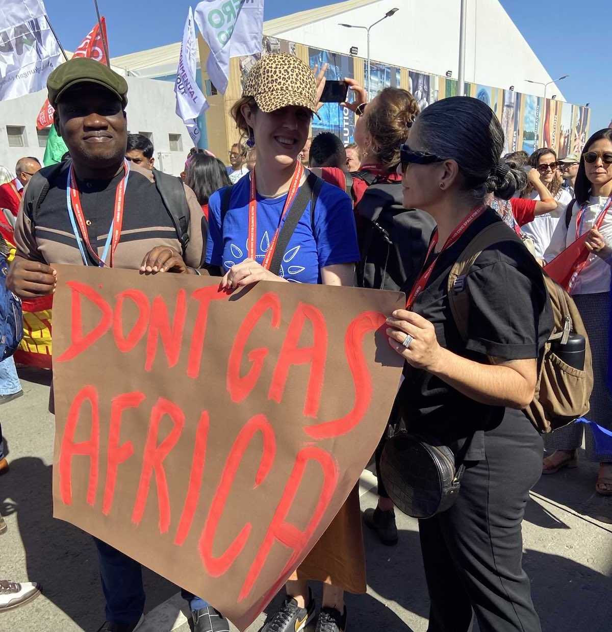 Here I am in the middle between two of my colleagues at an action outside of COP27