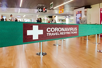 coronavirus travel restriction airport sign