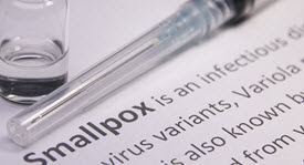 vial, syrnge, and the words "Smallpox"