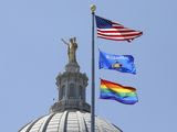 A rainbow flag observing Pride Month is displayed over the east wing of the Wisconsin State Capitol in Madison, Wis., Friday, June 7, 2019. The display, endorsed by Democratic Gov. Tony Evers, drew backlash from conservative Republican lawmakers who said it was divisive, while Democrats hailed it as a sign of inclusivity. (John Hart/Wisconsin State Journal via AP)  **FILE**