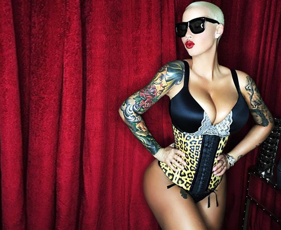 Amber Rose poses in a sexy corset showing off her super booty