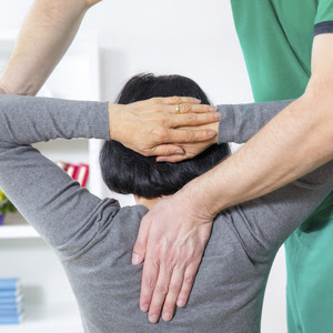 Chiropractic visit with woman