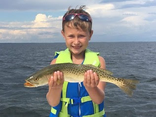 Cole holds a spotted seatrout