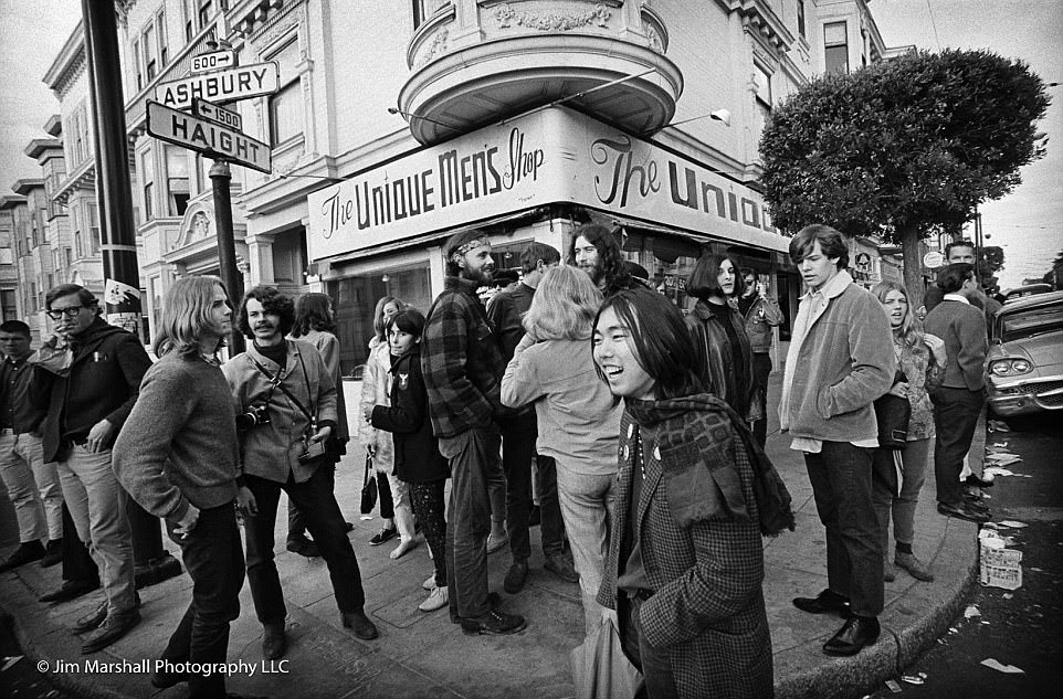 Crowds socialize on the famous corner of Haight-Ashbury streets in June 1967; the district became synonymous with the hippie movement. The Unique Men¿s Shop is now a Ben & Jerry¿s ice cream shop