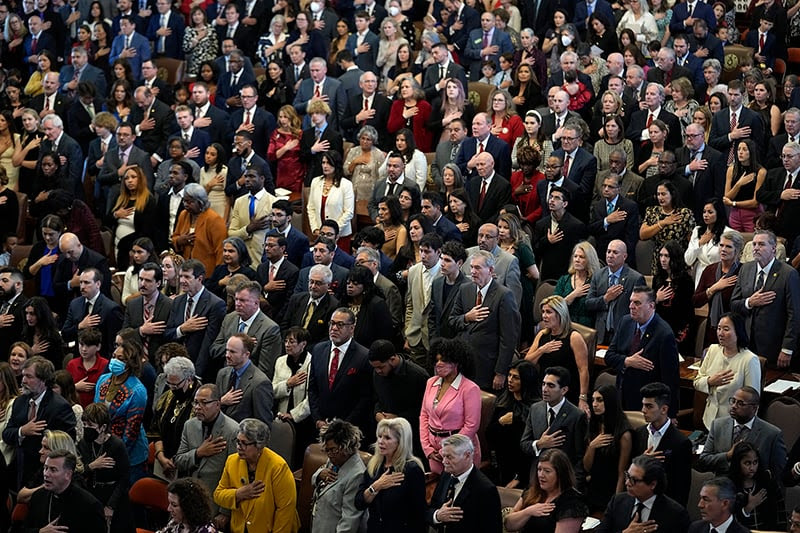 Texas House members with family and guests crowd the House Chamber at the Texas Capitol.