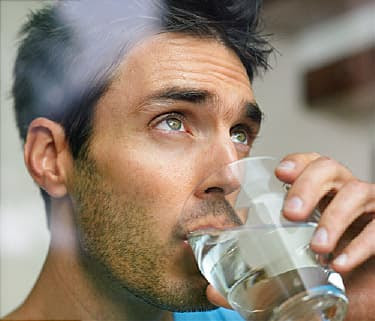 man drinking water