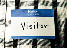 Photo of a name tag reading_ _Hello_ my name is Visitor_