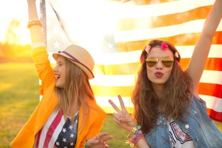 Hipster Teenage Girls In Front Of American Flag